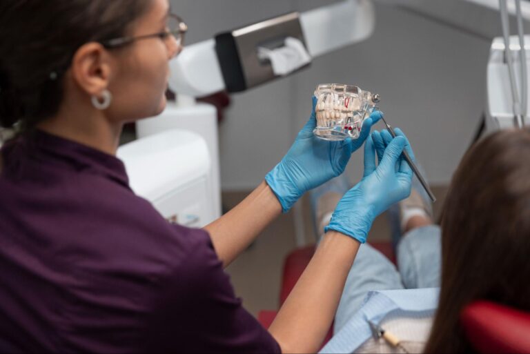 dentist showing woman prop